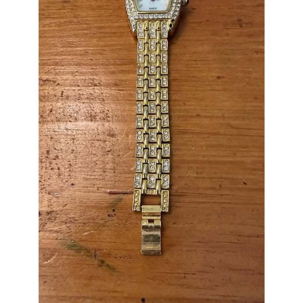 Nolan Miller Glamour Collection Crystal Gold Tone Bracelet Watch Mother Of Pearl